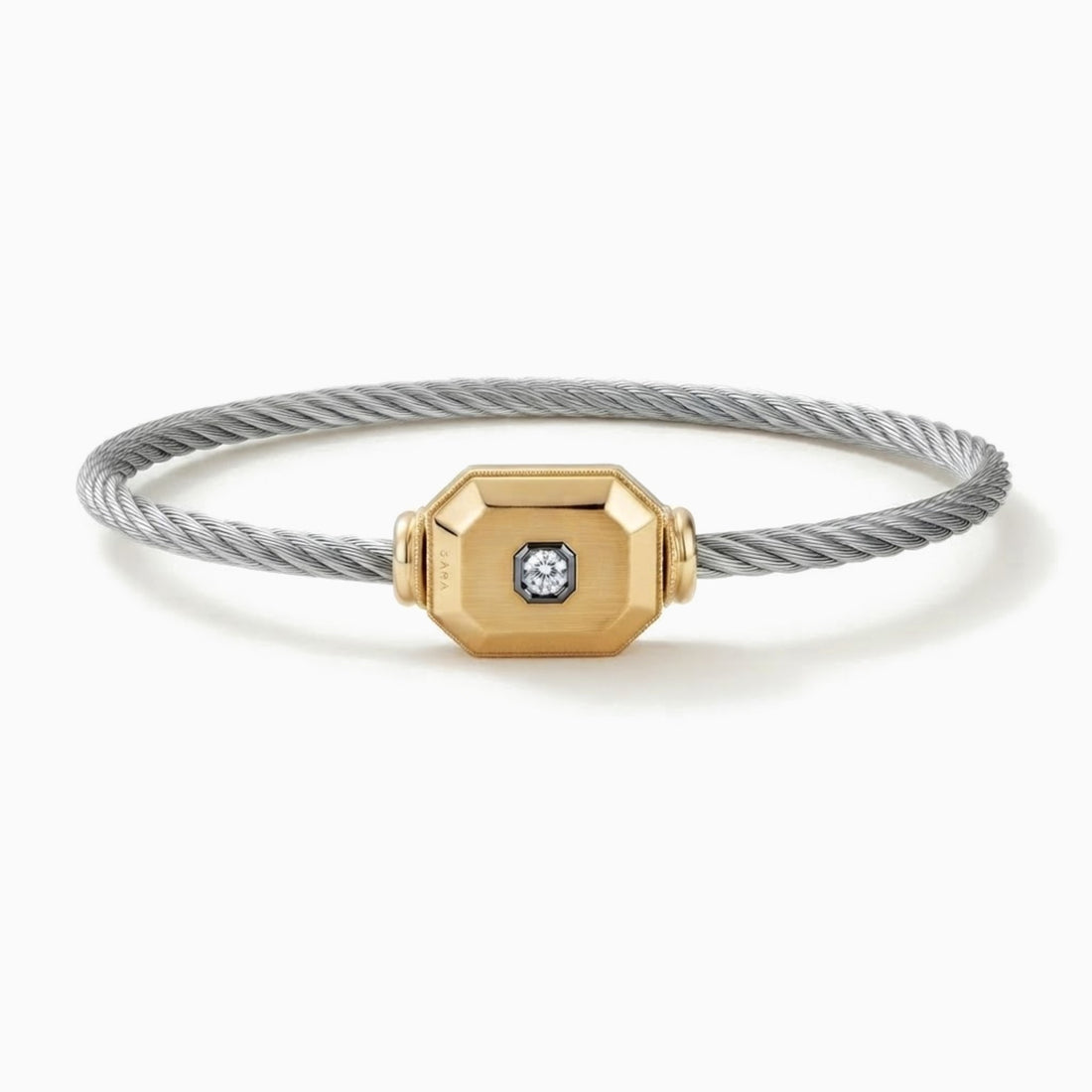 The Cornerstone men's cable bracelet with a faceted 14k gold octagon and a diamond in a black bezel