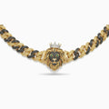 Front view of the crowned lion centerpiece on the black and gold Cuban chain