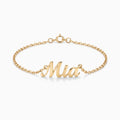 Gold script name bracelet on a fine chain