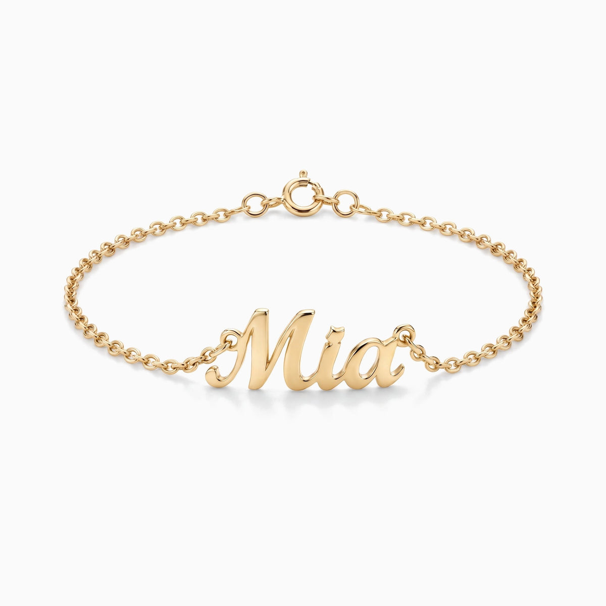 Gold script name bracelet on a fine chain