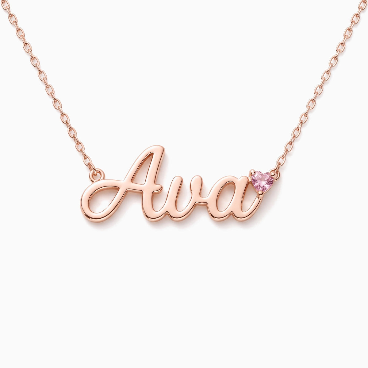 Rose gold name necklace with a pink heart birthstone