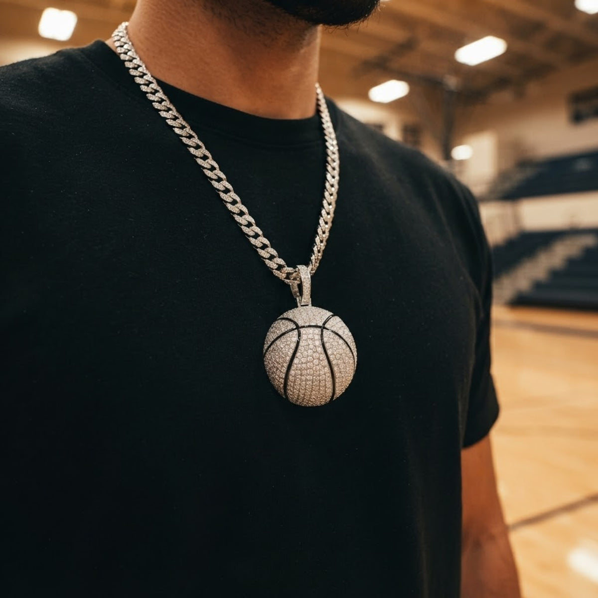 The MVP Pendant worn on a Cuban link chain on a basketball court